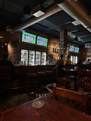 Bar area and TVs showing the game.