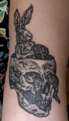 Muddy tattoo, can't even see the rabbit's leg