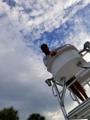 Captain Travis can easily point out manatee & dolphin from his crows nest.