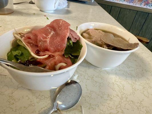 With tax. $22. Large beef pho two spring rolls two fried rolls. Sauce is perfect. Tons of meat. Tons of sprouts and herbs. Amazing.