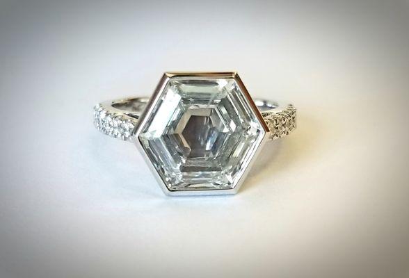 Hexagon diamond in platinum bezel setting