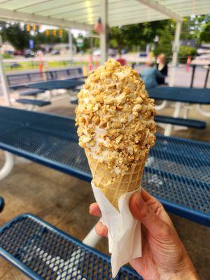 Vegan vanilla soft serve with crushed nuts