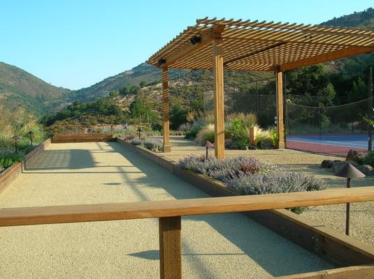 Custom Arbor and Bocce Court with landscaping and lighting