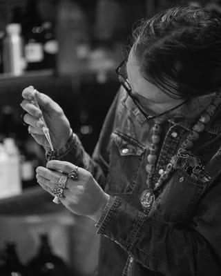 Jeremiah mixing new scents by hand in our workshop.