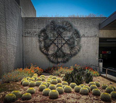 Ruth Asawa in the entrance to OMCA