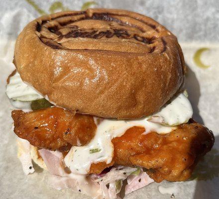 Buffalo Ranch chicken slider on a bed of house slaw.  Comes with hand cut fries and pickled okra.