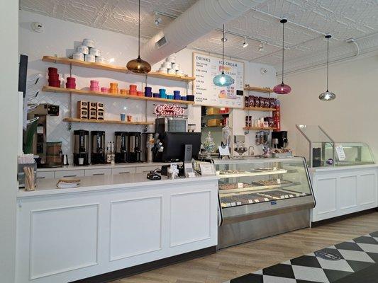 Cashier station with lots of desserts and coffee