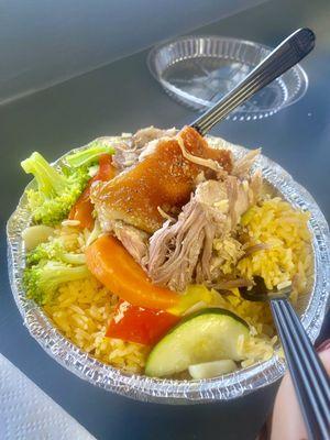 Roast pork with yellow rice and vegetables