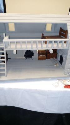 Inside of the log cabin dollhouse