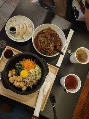 Japchae with beef, pan fried pork dumplings, tofu and egg bipbimbap, and  Green tea, barley tea (complimentary!)