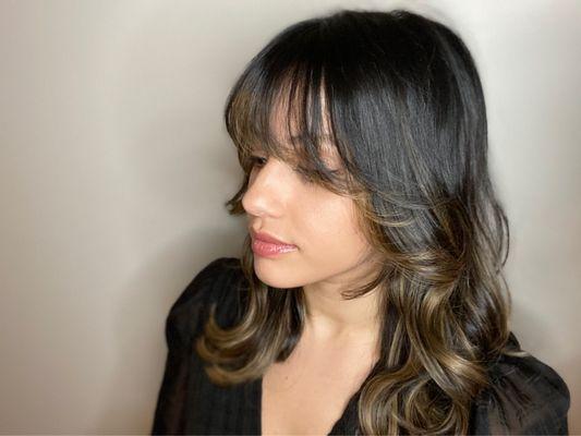 Black pigmented hair with soft highlights + bangs