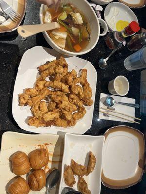 Fried pork ribs with sweet and sour sauce, dumplings, flower bread