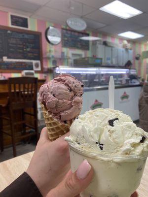 One scoop of Black raspberry Oreo in a waffle cone and two scoops of chocolate chip ice cream in a cup