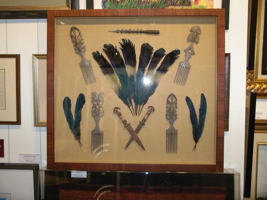 Pygmy tribe artifacts in shadow box. Keeping a memorable trip on your mind.