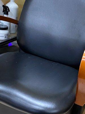 Dirty chair- dust and different kind of cut hairs