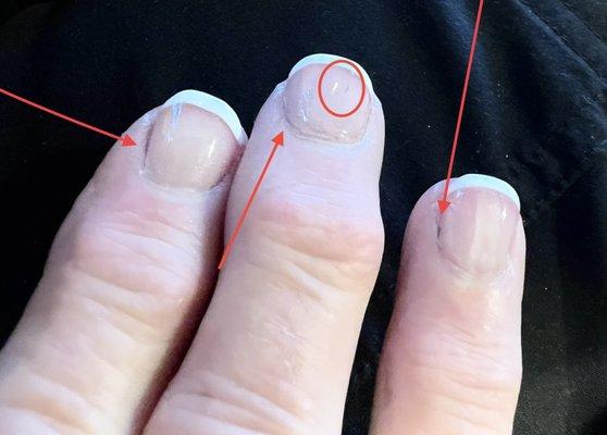 French manicure over a darker polish that was not removed by the manicurist.