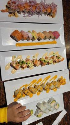 Sunkist, snow salmon, rainbow, spicy tuna crunch Rolls.