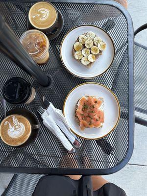 Lox toast, almond butter and banana toast, breve latte, CTC latte, drip coffee and cold brew