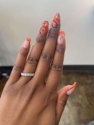 Gel nails with monarch butterfly design with rhinestones