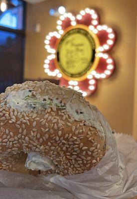 Sesame bagel with scallion cream cheese