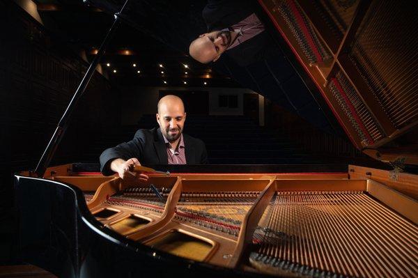 Tuning a piano before a concert in the Dominican Republic