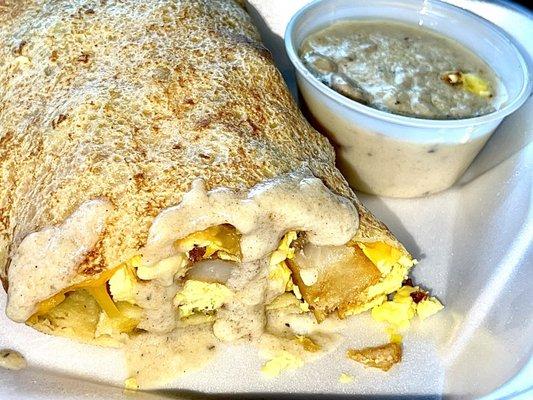 CREPITO CREPE, BACON, CHEDDAR CHEESE, SCRAMBLED EGGS, & COUNTRY POTATOES TOPPED WITH SAUSAGE GRAVY