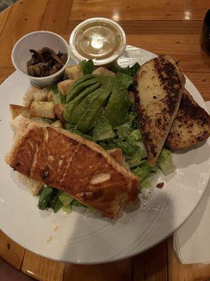 Salad with avocado, mushrooms and salmon added. Side of garlic bread.