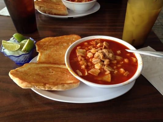 Menudo and glass of horchata