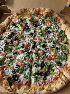 Delicious veggie pizza large prepared just right undercarriage cooked well Just the right amount of crisp,