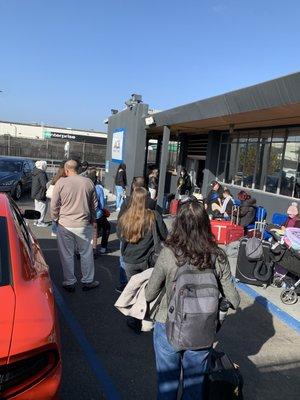 This is the line halfway through the parking lot at Ace Rent a Car. It was like a refuge camp.