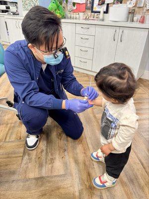 Dr. Norman showing our toddler the mirror