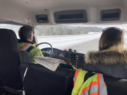 My wife and I in the cab with the owner of Brauner's Garage as he towed our stalled vehicle to a local dealership on Christmas Day.