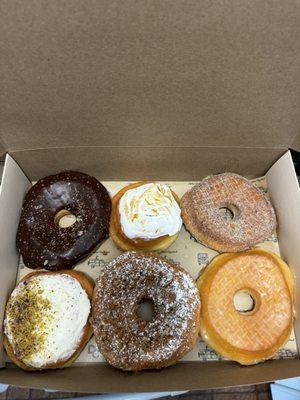 chocolate ganache, blood orange cream with merengue, earl grey, rose water pistachio, cinnamon streusel buttermilk glazed.