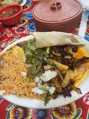 Carne asada plate . May not look like much but it was tasty AF