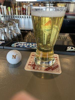 An excellent Pilsner, New Trail Lazy River Pils.  And a golf ball from the adjacent course that flew by on the way in to lunch.