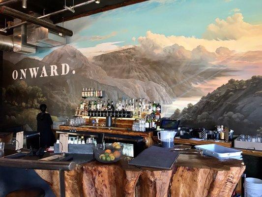 Bar with stump tabletop and Columbia River Gorge painting