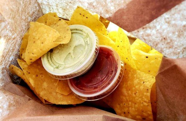 Complimentary chips & salsa and extra lime cilantro sauce