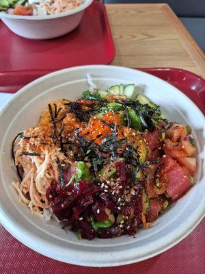 Delicous Poke bowel, Tuna and Spicy Salmon base.  Tons of toppings.