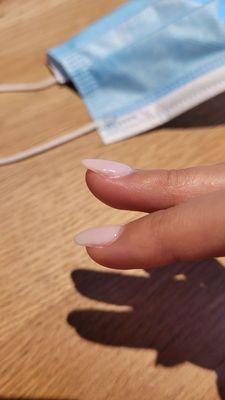 Sides of the dip powder nails are uneven and partially unfilled