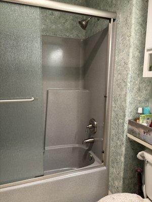 Finished shower stall with beautiful raindrop doors.  Bathroom demolition starts next week.