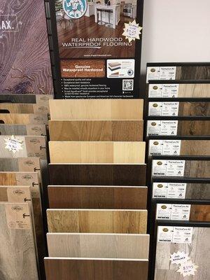 Imperma wood Real hardwood waterproof flooring lifetime residential warrantee padding attached extra rigid core.