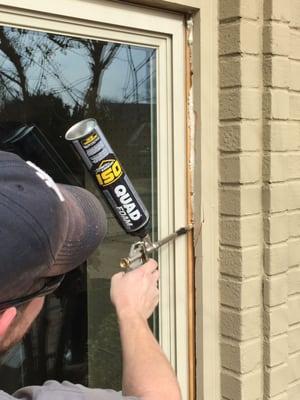 Here, we are filling the spaces between the structure of your home and the actual window unit to ensure we have sealed all im...