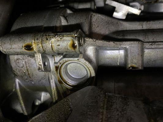 Massive oil leaks and antifreeze leaks that Maximum Auto Outlet knew about and steam cleaned to present the car for sale.