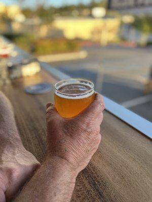 Sitting on their "patio" with a view enjoying a cold one