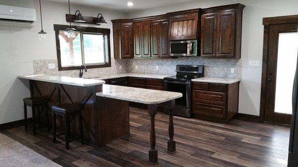 Seabrook Black Canyon floating vinyl plank
 Travertine Ancient Mosaic Offset Silver at kitchen backsplash