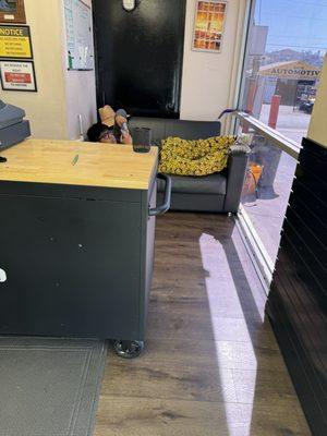 This is the first thing you see when you walk in. A guy in pajamas laying down behind the register.