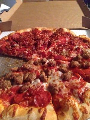 Double pepperoni and half sausage and half bacon pizza. Awesome pizza for a franchise - they don't his back on the toppings