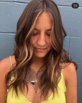 Face framing balayage highlights and a cut and style with waves