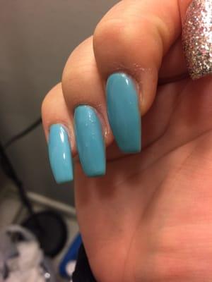 Hair stuck under gel top coat on ring finger and sides left unpainted or on my skin...