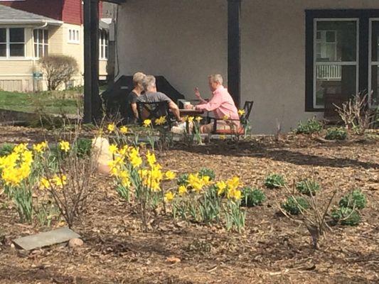 Meeting with clients in the backyard garden at our office.